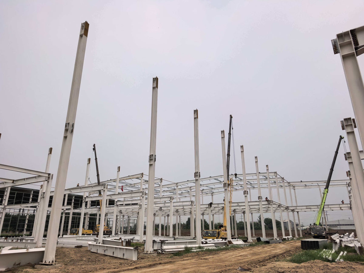 Foundation and steel column installation at GEYA’s new manufacturing campus construction site.
