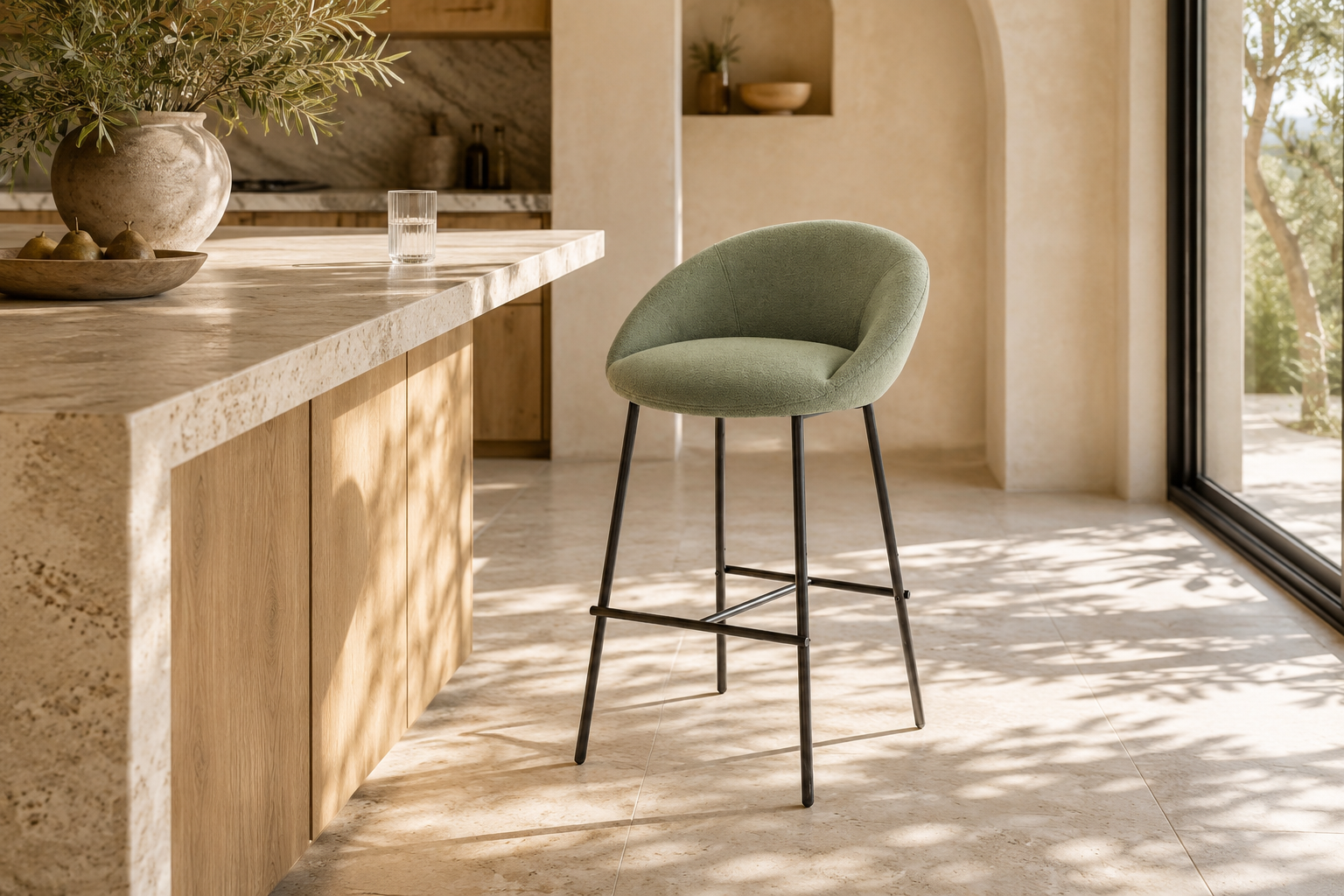 Sage green curved-shell bar stool in a boutique apartment kitchen island setting with structured woven upholstery and matte black H-bar footrest frame.