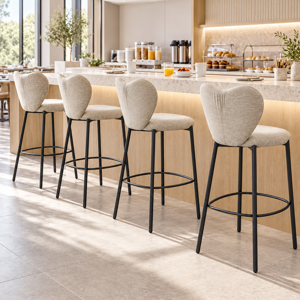 Upholstered bar stools in ivory lined along a breakfast counter, showing repeated double-lobed backs and circular footrests, BC-152-750