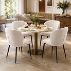 Bouclé barrel-back dining chair in cream around round marble dining table in residential dining room — DC-3155