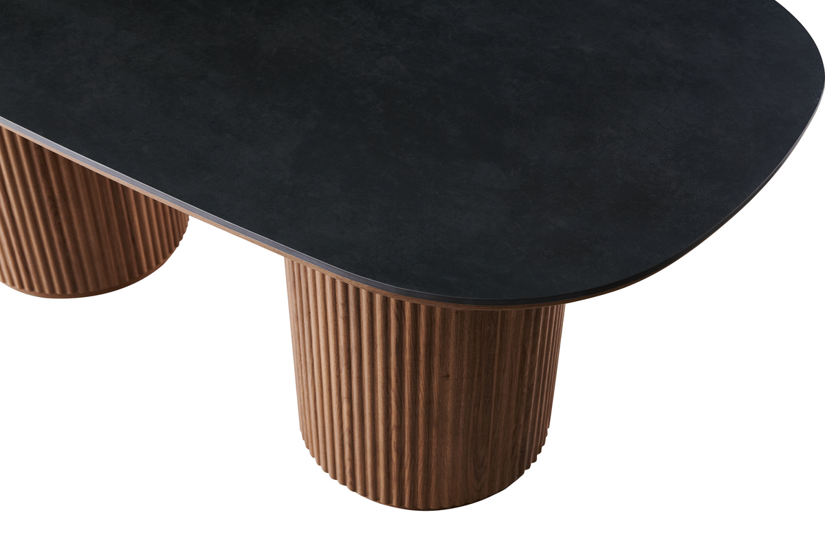 Sintered stone dining table detail with matte dark grey edge and fluted wood-grain pedestal, T-136