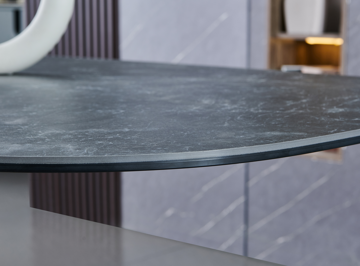 Sintered stone dining tabletop in grey, close-up of layered edge and curved corner profile, T-99
