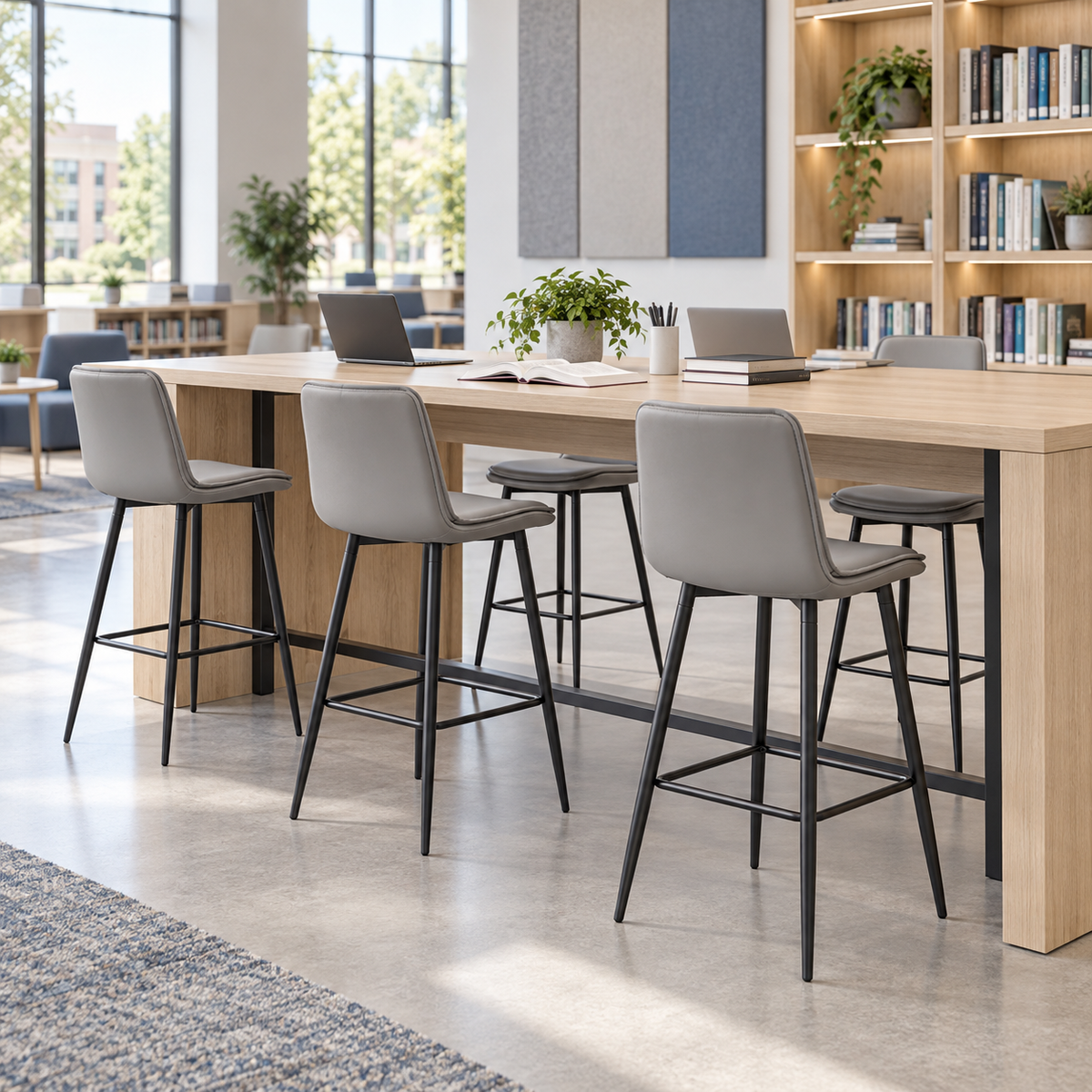Upholstered bar stools in Mist arranged around a collaborative workplace bench BC-66-705