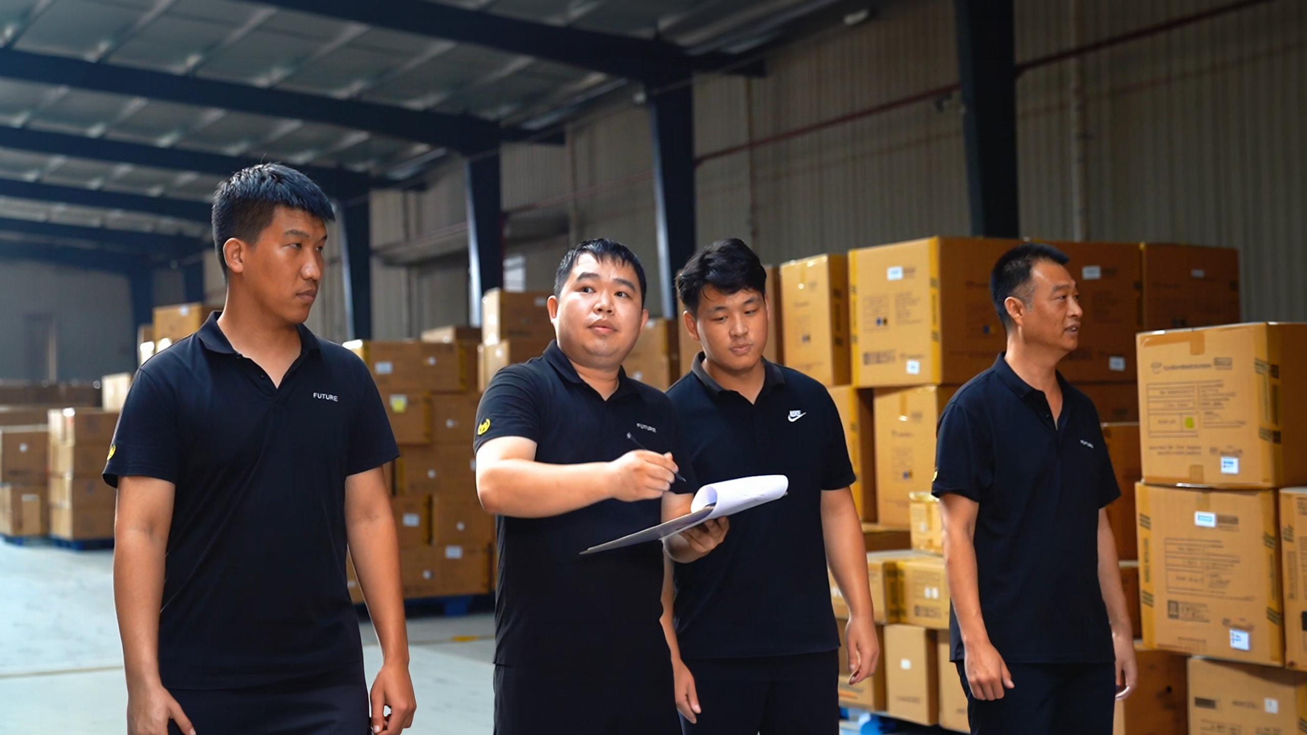GEYA furniture export team checking packed seating and table orders for global wholesale projects