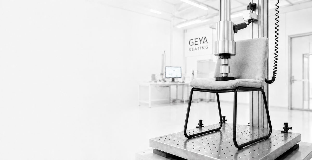 GEYA upholstered chair undergoing vertical seat-load testing