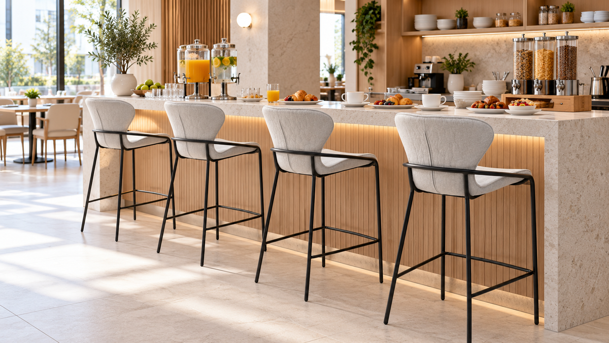 Upholstered bar stools with wraparound steel frames lining a hotel breakfast buffet counter, BC-85-750