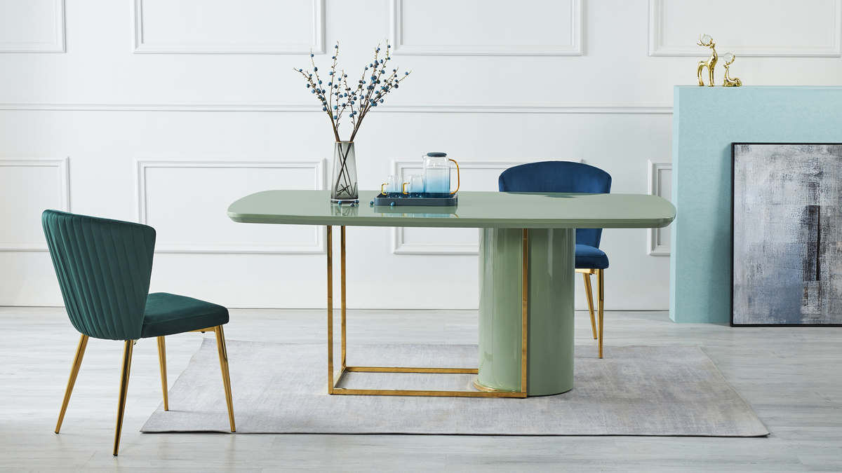 Lacquered pedestal dining table with green and blue velvet chairs in a contemporary residential space, T-64