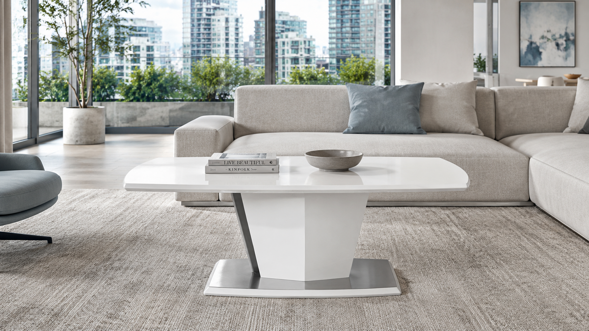 GEYA Seating™ CT-18 white coffee table in a light urban apartment lounge with neutral sofa, soft blue accents, city view, and bright natural daylight.
