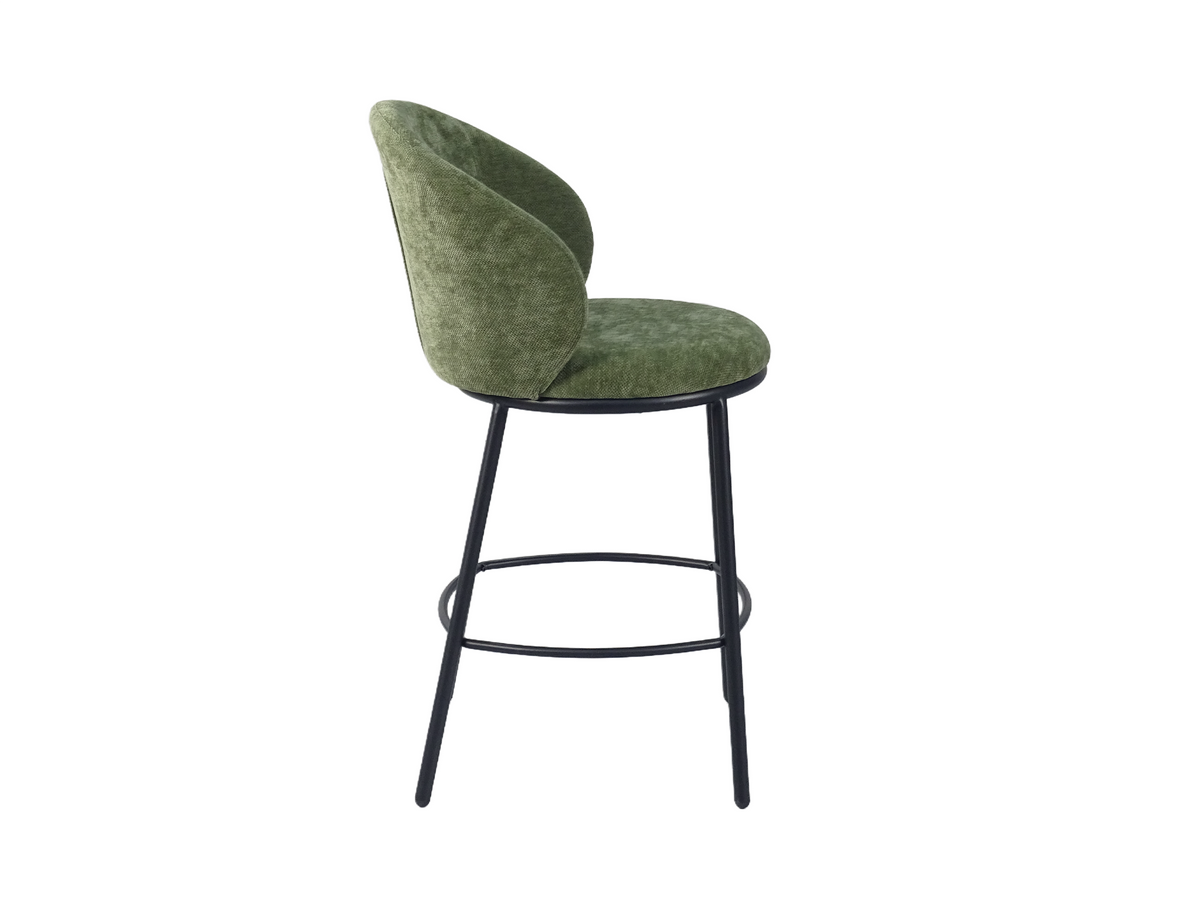 Linen-look bar stool in olive green, side view showing the forward-curving backrest and tubular steel legs, BC-137-750