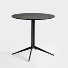 T-197 Round Melamine Bistro Table on Splayed 4-Leg Base — Black, Matte Black Sand-Grain Powder-Coat Steel Frame — GEYA Seating