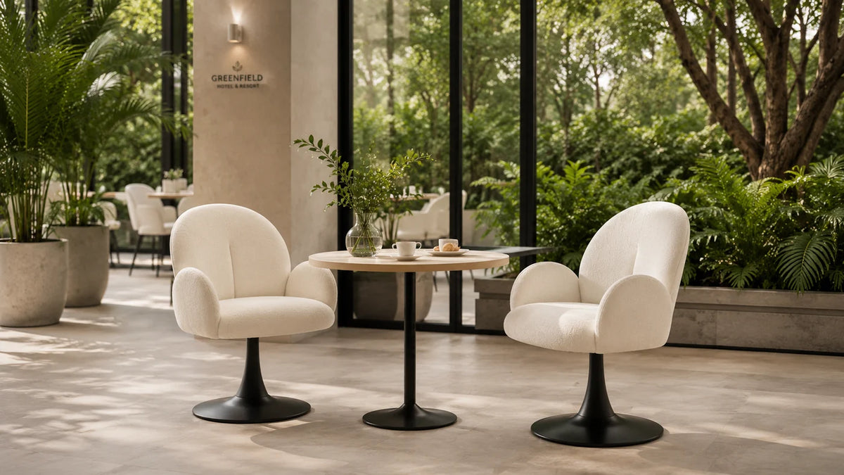 Upholstered accent chairs in a hotel terrace lounge setting