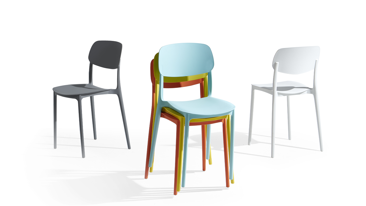 Mixed-color configuration of polypropylene chairs in a stacked arrangement PC-133