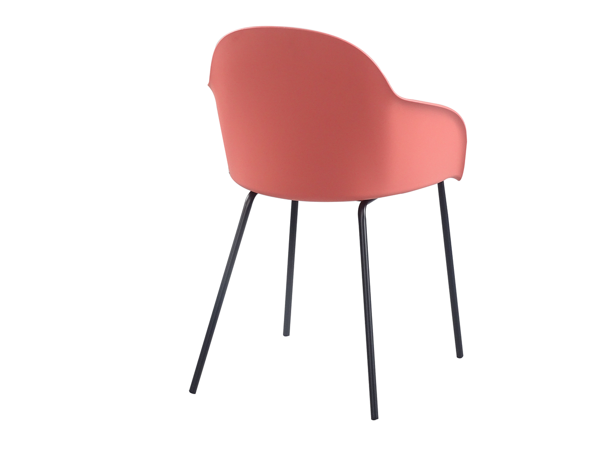 Rear view of coral polypropylene armchair showing fully closed shell back and four black round-tube steel legs PC-16