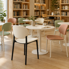 PP side chairs in Ivory, Sage green and Blush pink around café tables in a library reading area PC-103 