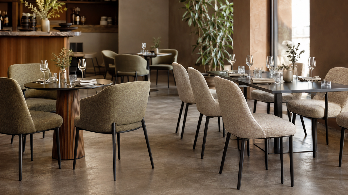Upholstered dining chairs around restaurant tables in a contemporary café and commercial dining interior