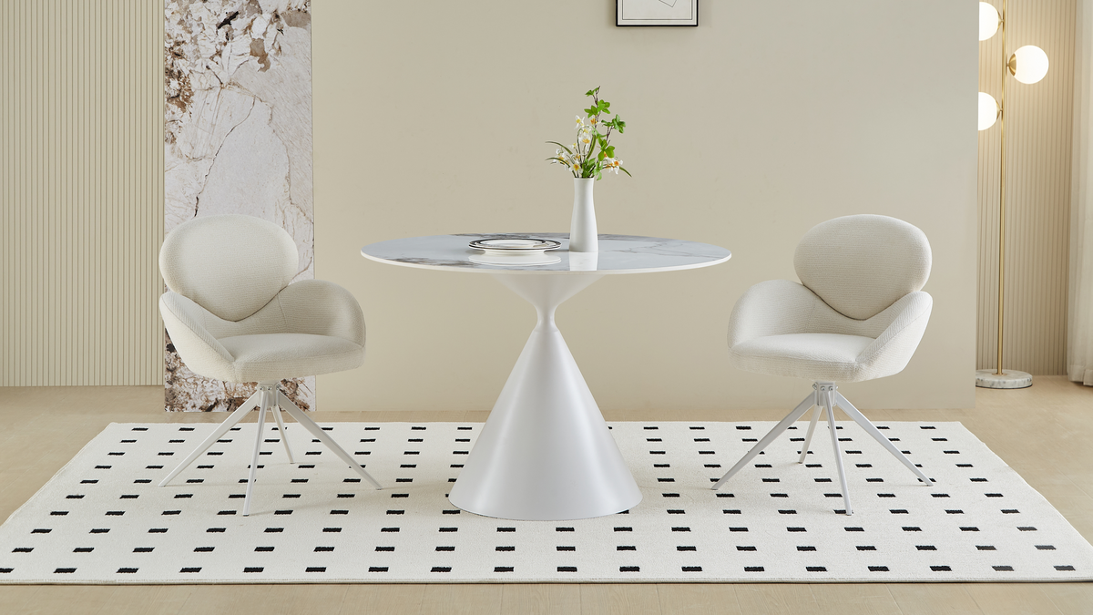 Round sintered stone dining table between two upholstered swivel-style chairs in a bright interior, T-133