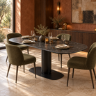 Sintered stone pedestal dining table in dark grey with olive green chairs in a terracotta dining setting, T-99