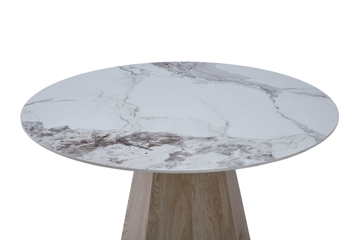 Close-up detail of round sintered stone tabletop showing marble veining and beveled edge, T-132