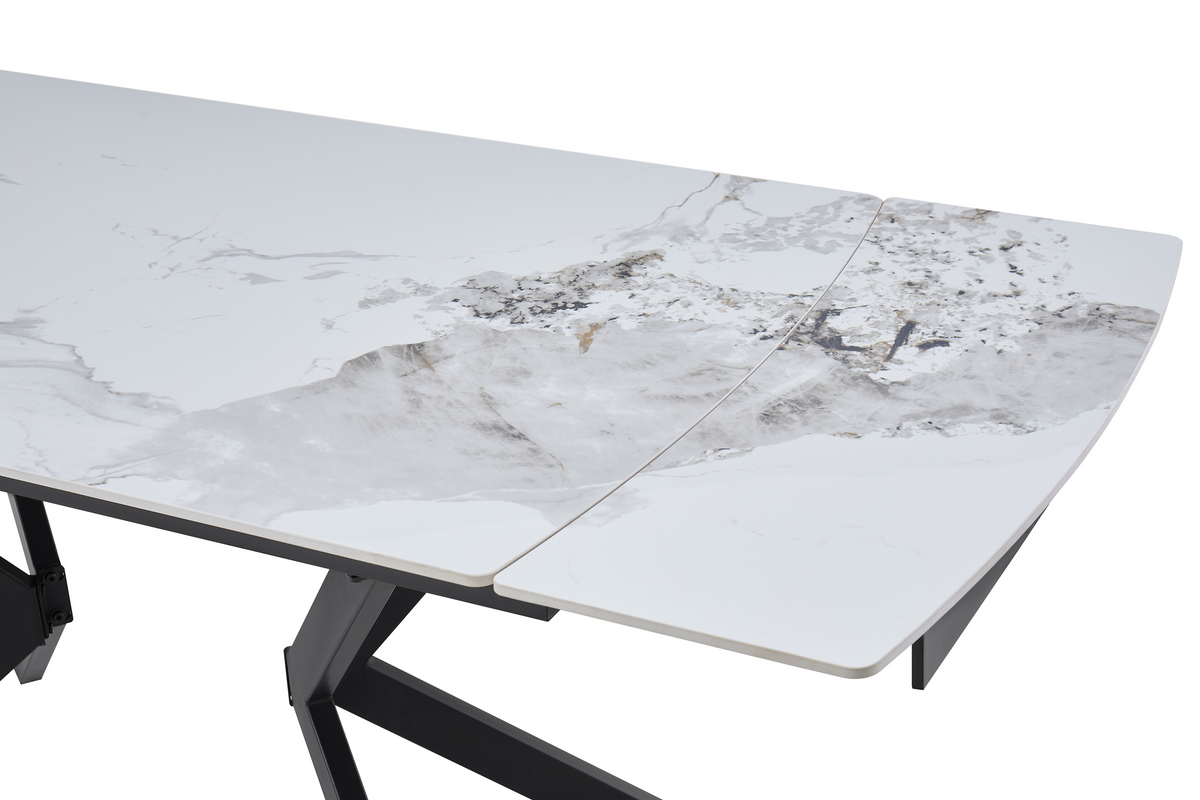 Close-up detail of sintered stone tabletop showing marble veining pattern and sliding extension seam, T-105