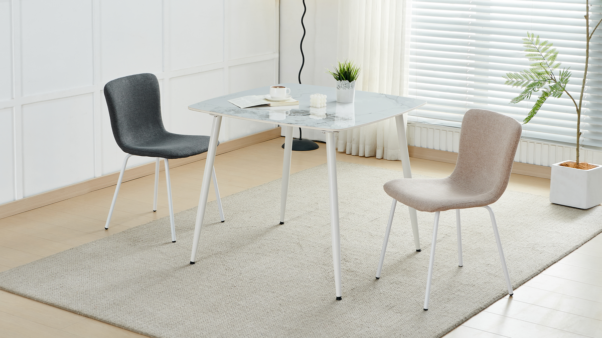 Square sintered stone dining table paired with two upholstered chairs in a sunlit breakfast corner, T-123