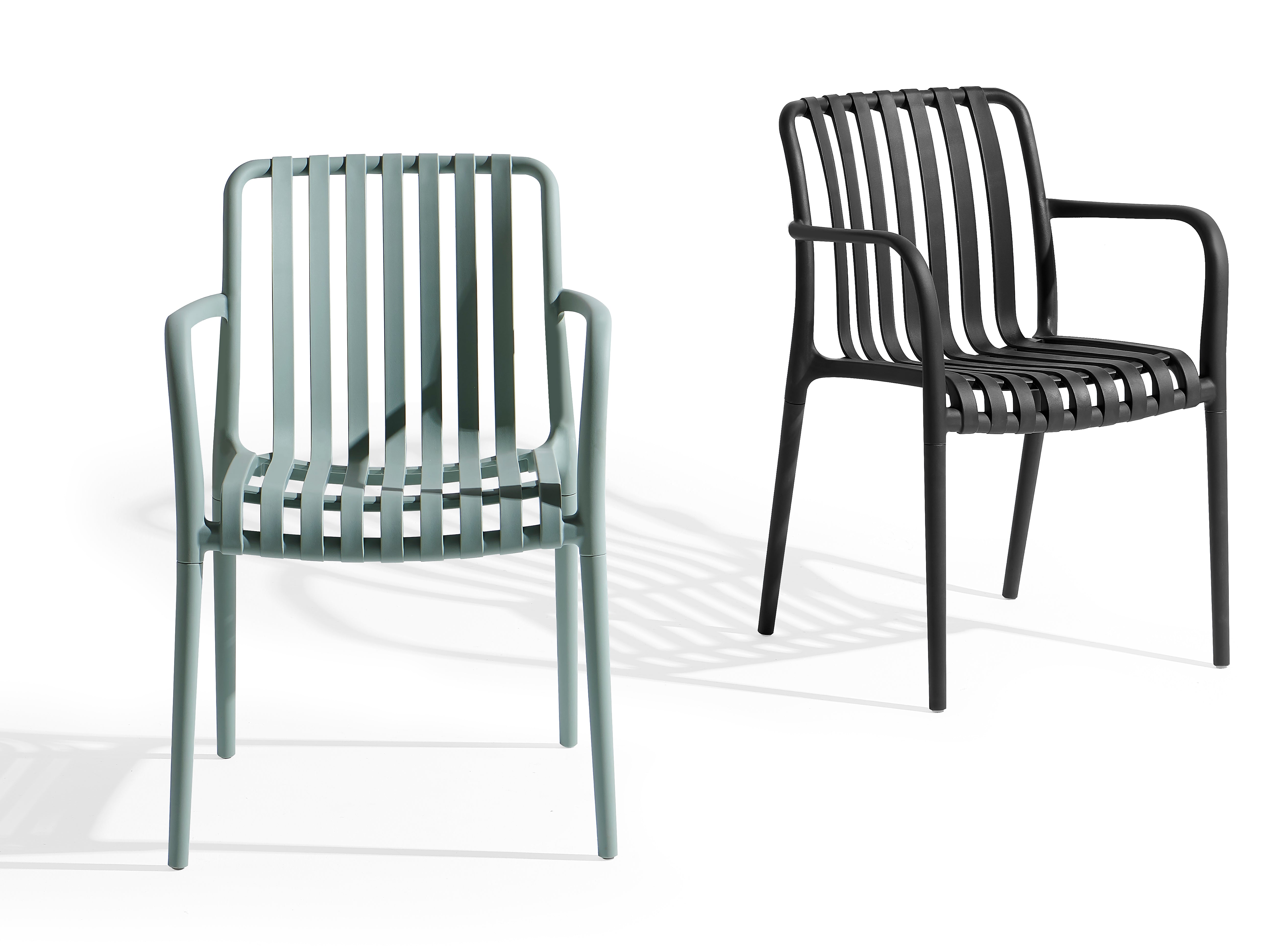 Stackable PP armchair PC-136 shown in Soft Sage Green and Matte Black color options
