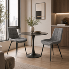 Charcoal grey structured woven dining chairs around black round table in city apartment dining room, DC-3218