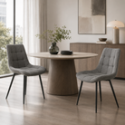 Charcoal grey structured woven dining chairs around black tulip pedestal table in city apartment dining area with floor-to-ceiling windows, DC-3218