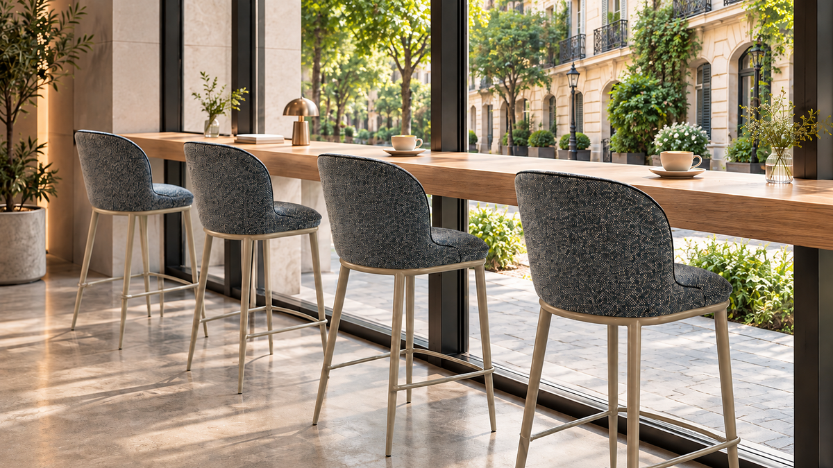 Upholstered bar stools in Blue Grey arranged along a café window counter facing a European street, BC-176-750