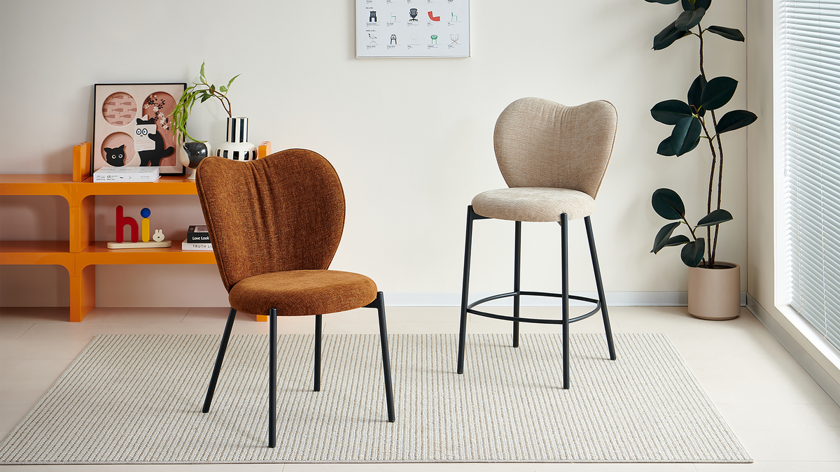Upholstered bar stool in light greige with a double-lobed back and circular footrest, displayed beside a brown chair, BC-152-750