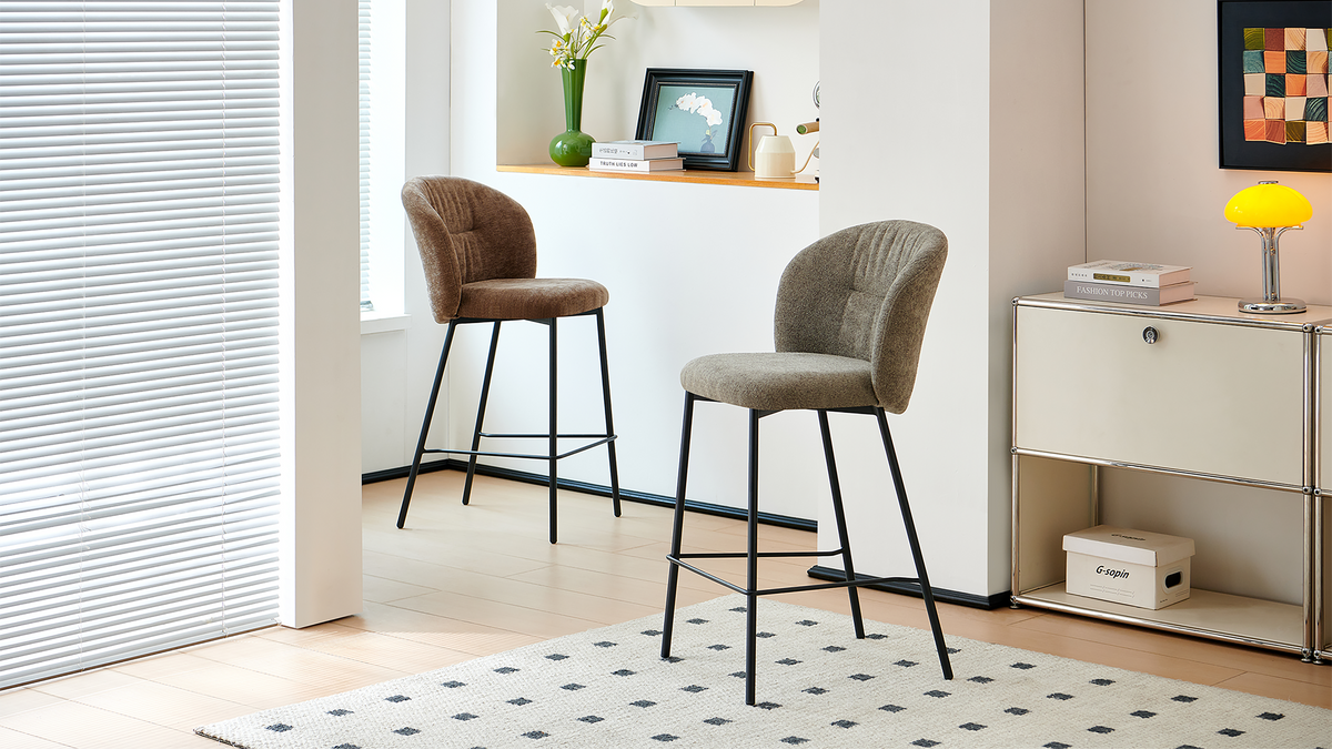 Upholstered bar stools in mocha and warm grey arranged beside a home counter in a window-lit interior, BC-153-750
