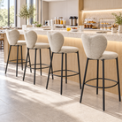 Upholstered bar stools in ivory lined along a breakfast counter, showing repeated double-lobed backs and circular footrests, BC-152-750