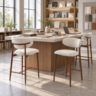 Upholstered bar stools in ivory white around a design studio high table with material samples, BC-157-750