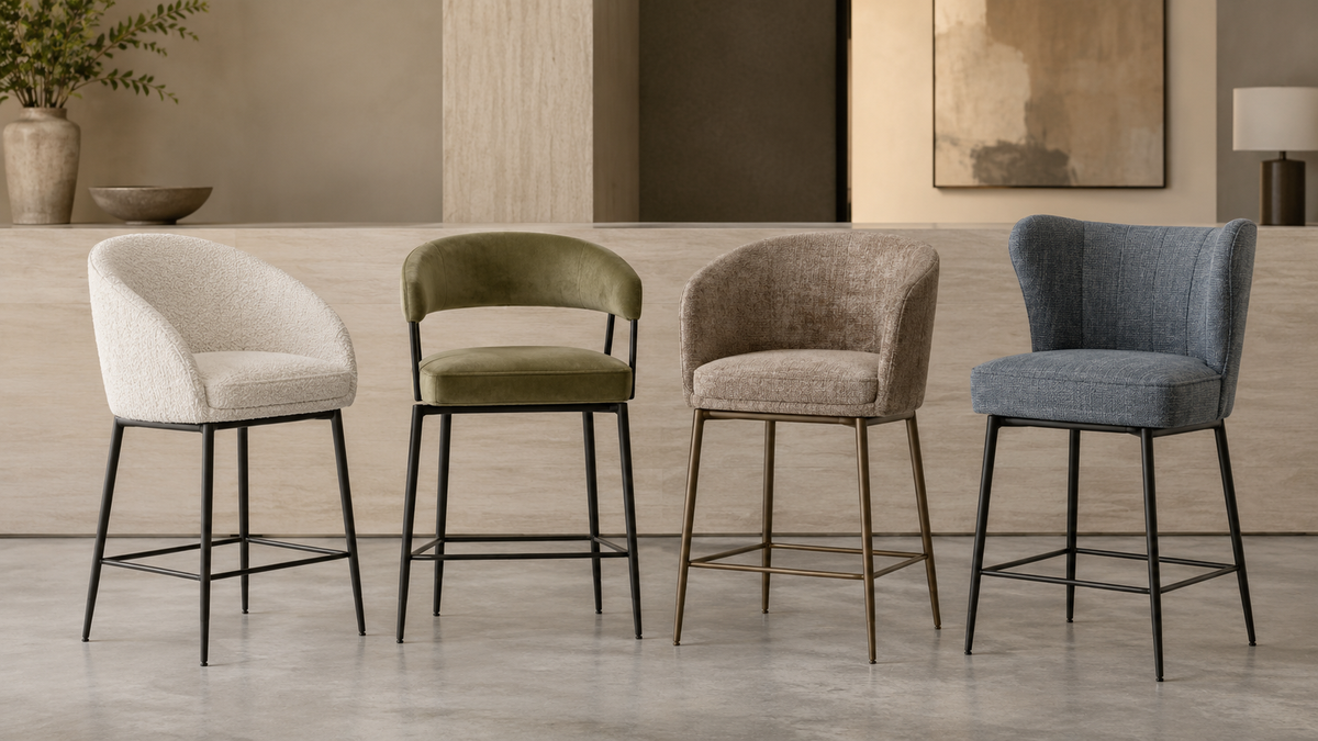 Upholstered counter stools with supportive backs, coordinated fabric finishes, slim metal frames and integrated footrests.