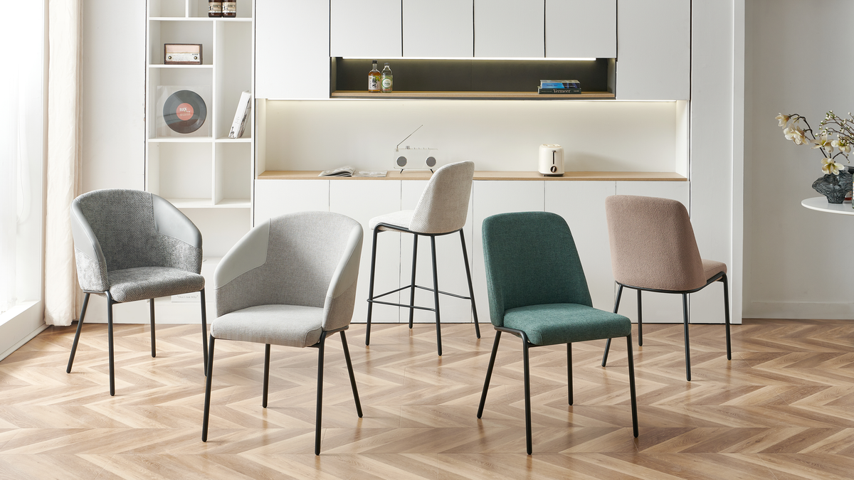 Green and camel soft-square dining chairs in a modern open living showroom with herringbone floors DC-3070

