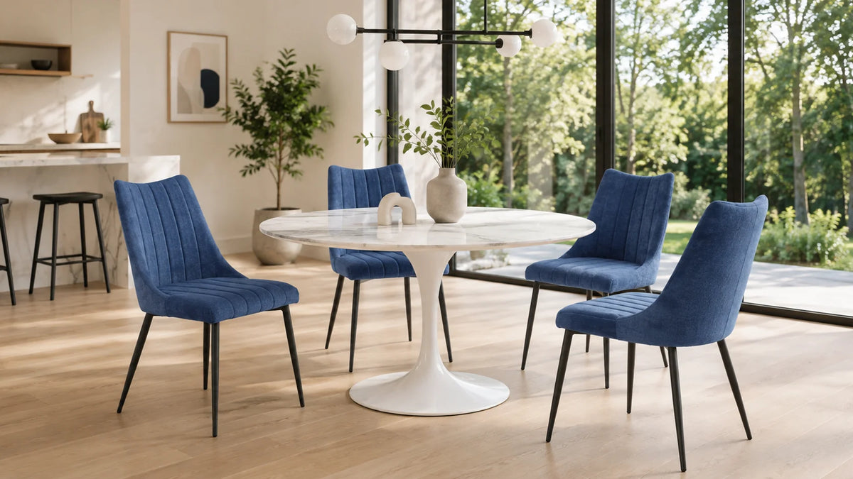 Upholstered dining side chairs with metal legs around a round dining table
